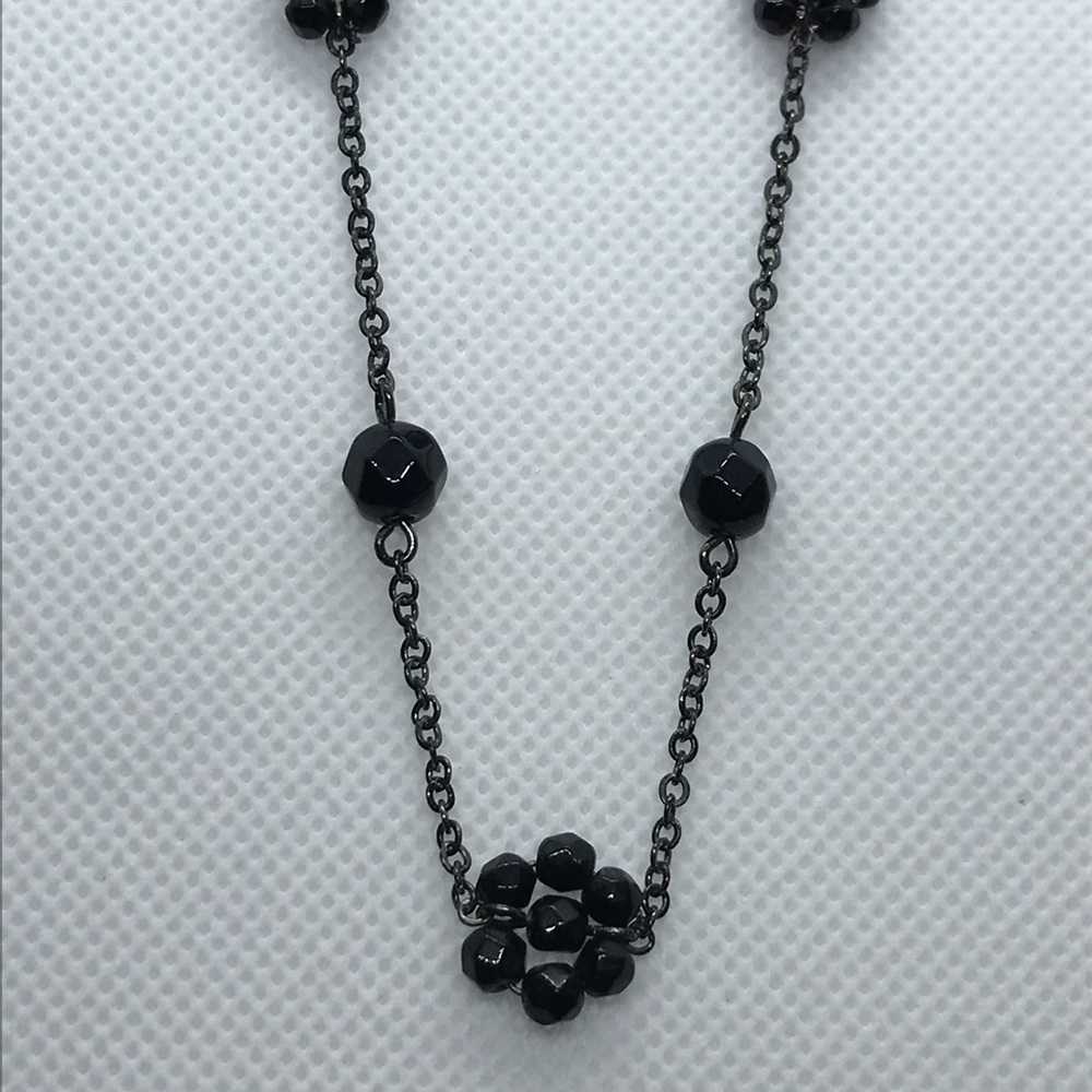 Black beaded chain necklace signed 1928